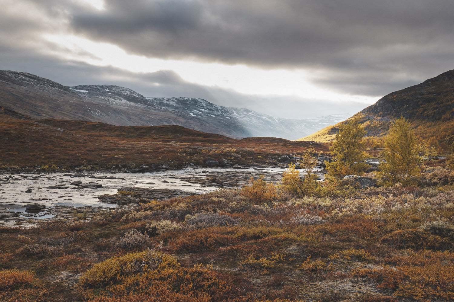 Fall in Swedish lapland with mountains and a river